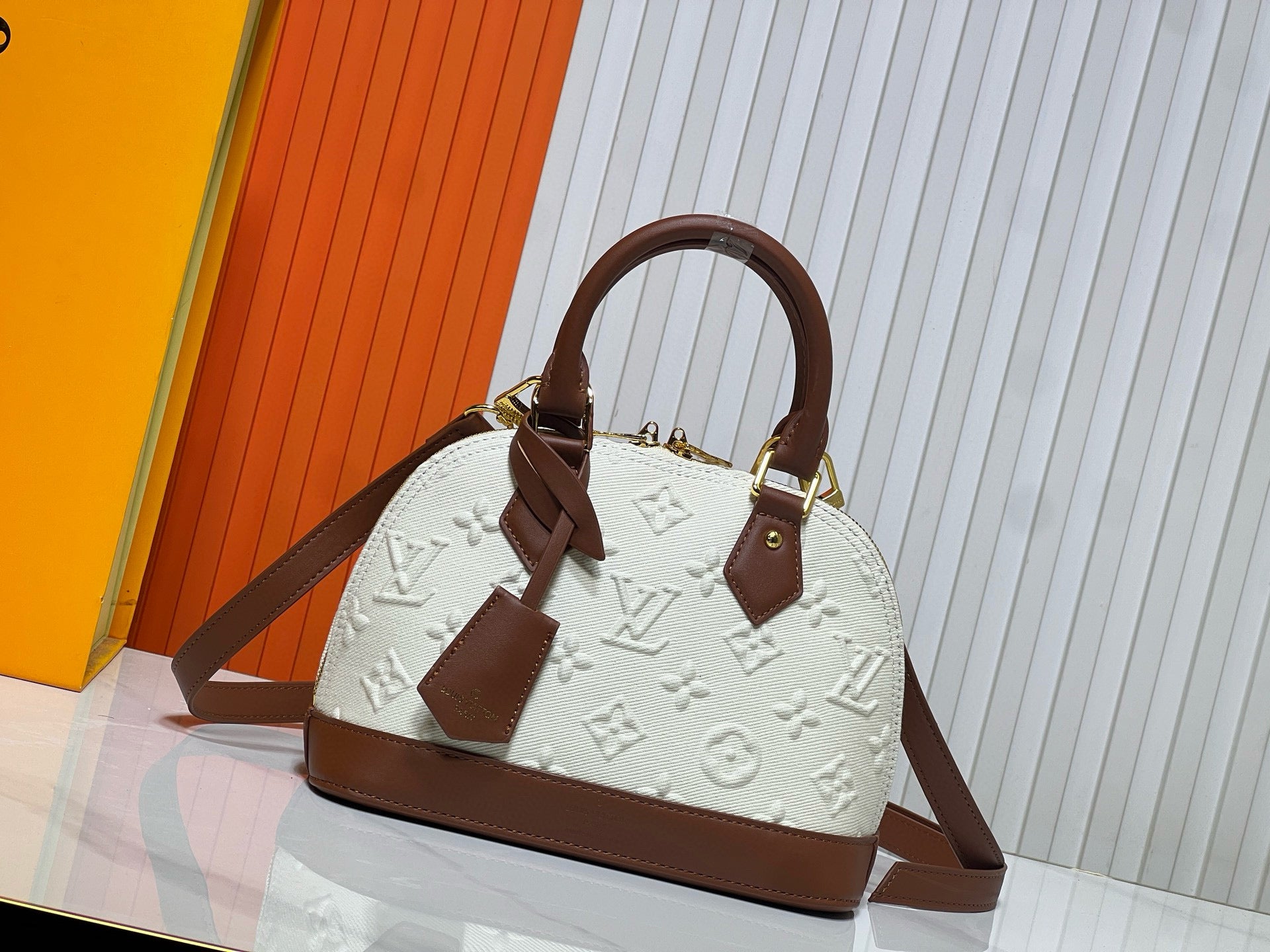 Louis Vuitton Alma BB in Bicolor Monogram Empreinte Leather (Cream & Cognac)